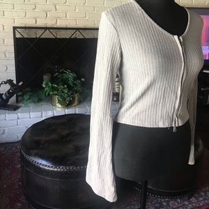 A light grey, totally 90s pant suit. Sleeves are flair and so are the pants.